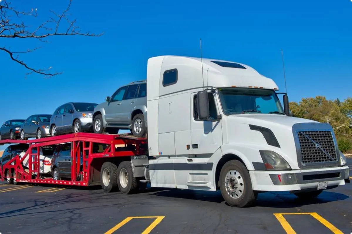 Open car transportation via trucks